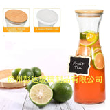 Glass carafe with bamboo Lids