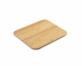 Joseph Joseph Chop2Pot Bamboo large folding chopping board lying flat.