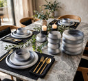 Swirl glass dinner set 18 piece in grey, frosted ombre plates and bowls on a dining table