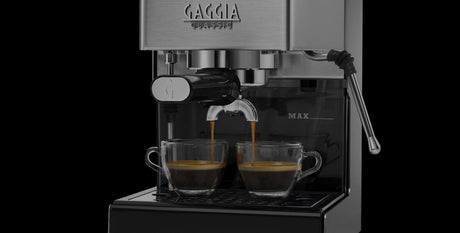 Close-up of the Gaggia Classic E24 58mm stainless steel portafilter and brass brew group
