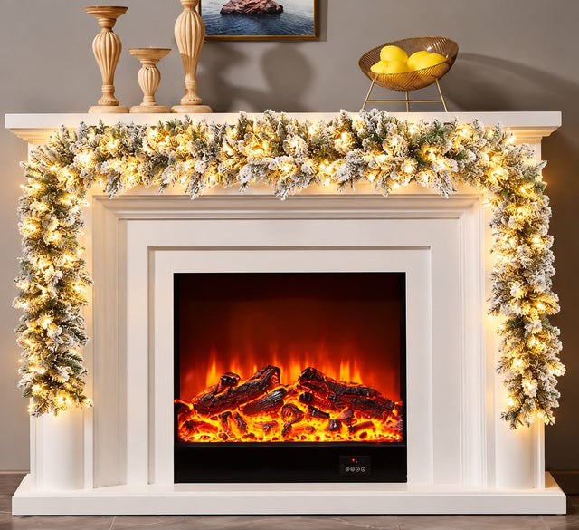 Snow flocked Christmas garland with built in warm white lights, 2.7m, on a fireplace mantel